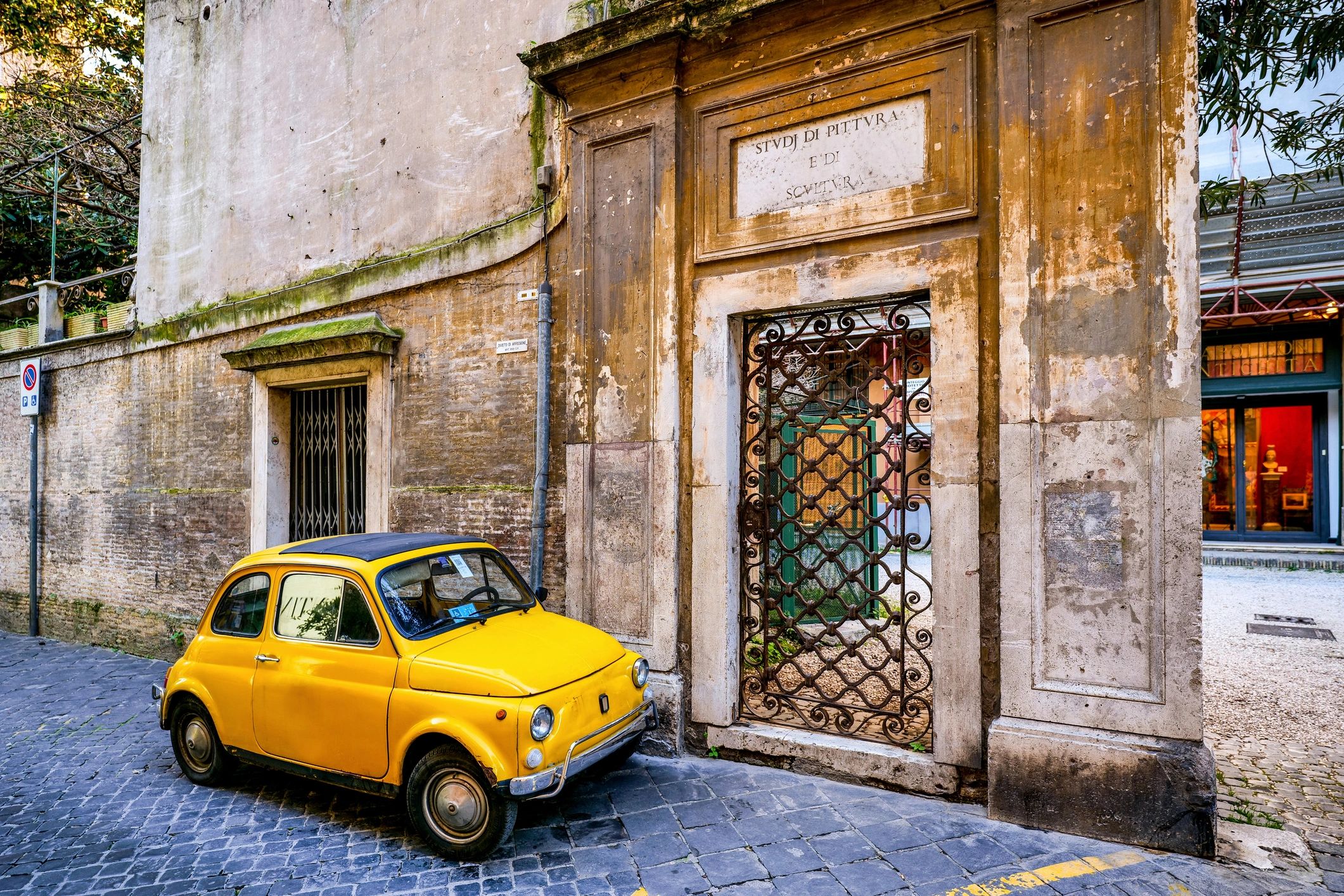 retro small car on city street