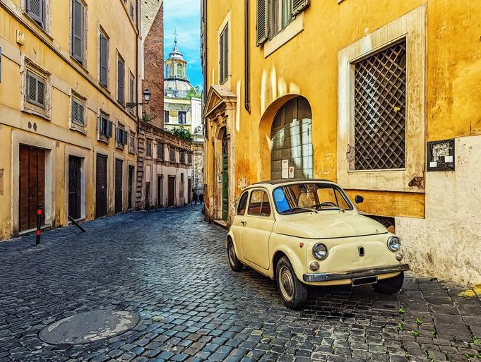 retro small car on city street