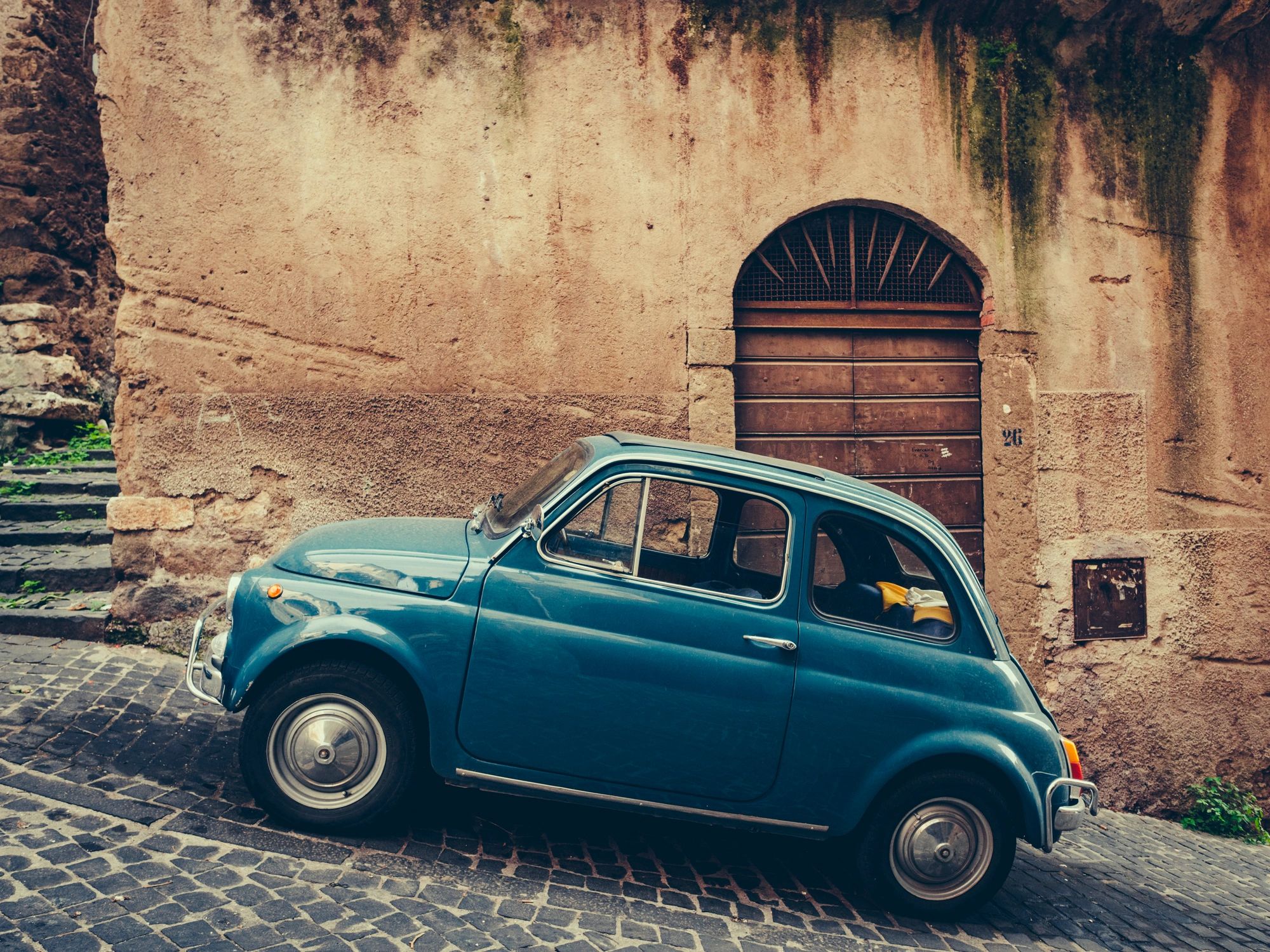 retro small car on city street